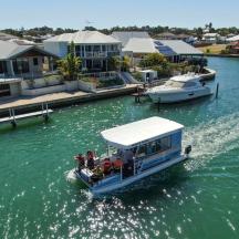 a boat in the water next to some houses