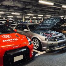 a group of cars parked in a garage