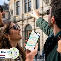 a group of people looking at a map on a cell phone