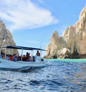 a group of people on a boat in the water