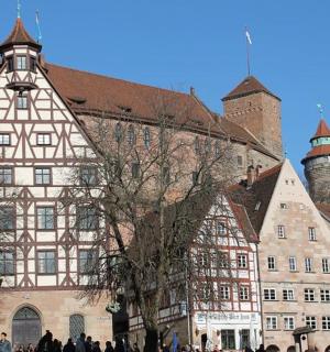 a large building with people walking in front of it