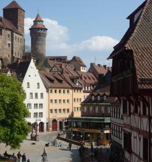 a group of buildings in a city with a tower