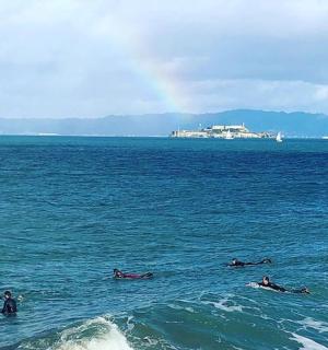 a group of people swimming in the ocean