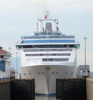 a large cruise ship is docked at a dock