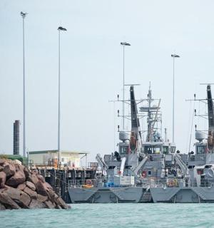 a group of boats docked in the water