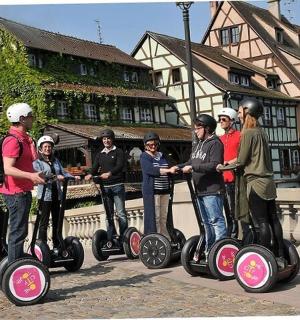 a group of people are riding on segways