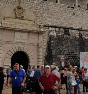 a group of people standing in front of a building