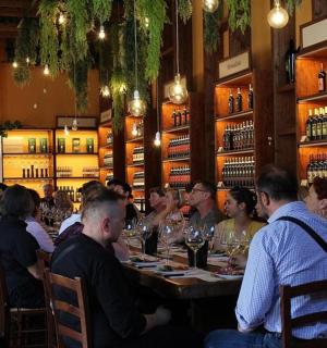a group of people sitting at a table in a restaurant