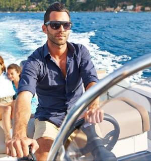 a man and two children sitting on a boat