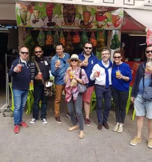 a group of people posing for a picture in front of a store