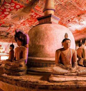 a group of statues sitting in a room