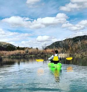 a person in a kayak on a river