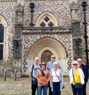 a group of people standing in front of a building