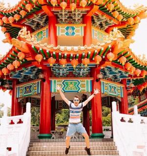 a man standing in front of a building