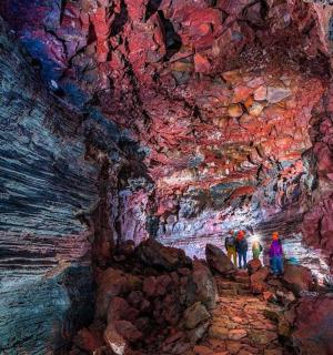 a group of people standing in a cave