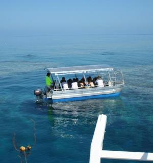 a group of people in a boat in the water
