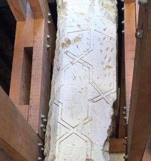 a door in a building with a stone pillar