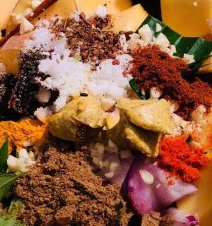 a plate of food with spices and other vegetables