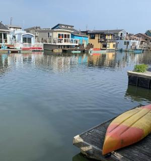 a kayak sitting on a dock on a body of water
