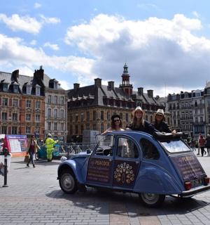 a group of people riding in a small car