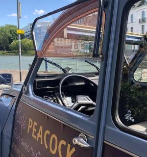 a small car with its door open with the front