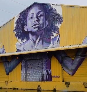 a building with a large painting of a man on it