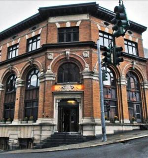 a brick building on a city street with a traffic light