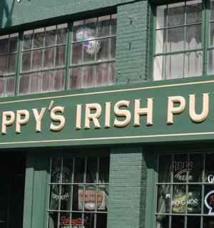 a shop with a sign that reads happys irish pub