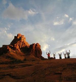 a group of people standing on top of a mountain
