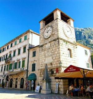 a clock tower on the side of a building