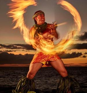 a man in a fire costume standing in the water