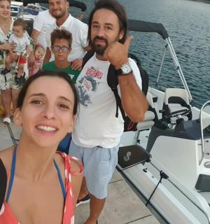 a group of people on a boat in the water