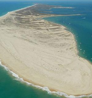an aerial view of an island in the ocean