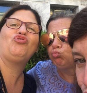 a group of three women posing for a picture