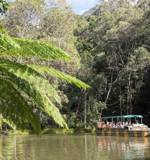 a group of people on a boat on a river