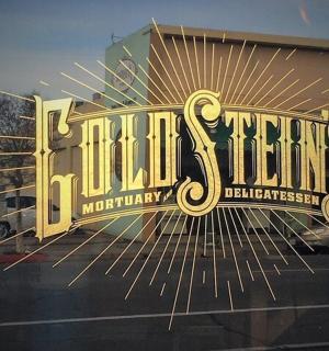 a window of a store with a sign on it