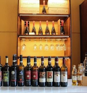 a bunch of bottles of wine on a shelf