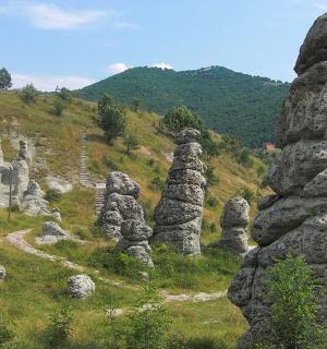 a group of rock formations on a hill