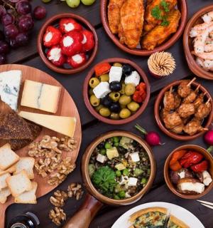 a table topped with lots of different types of food
