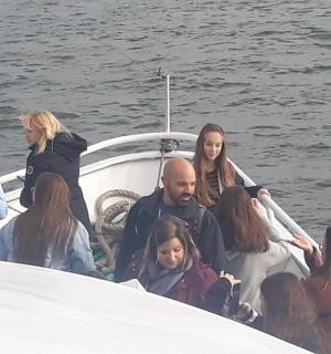 a group of people on a boat in the water