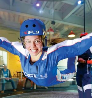 a man riding a skateboard on a ramp