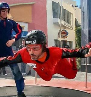 a man falling off of a ramp on a trampoline