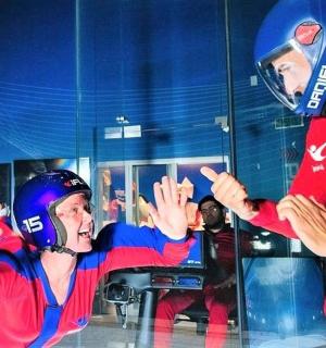 a man and a woman standing in front of a mirror