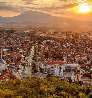 an aerial view of a city at sunset