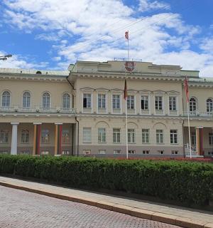 a large building with a flag on top of it