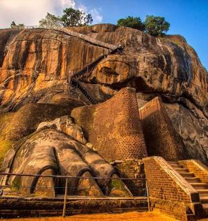 an elephant statue in front of a mountain