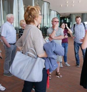 a group of people standing around in a mall
