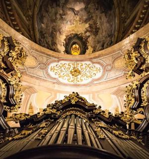 an ornate ceiling of a building with a domed ceiling