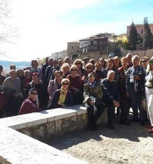 a large group of people standing on a wall