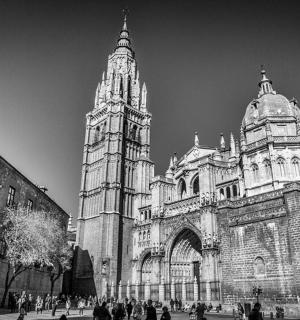 a black and white photo of a cathedral with two towers